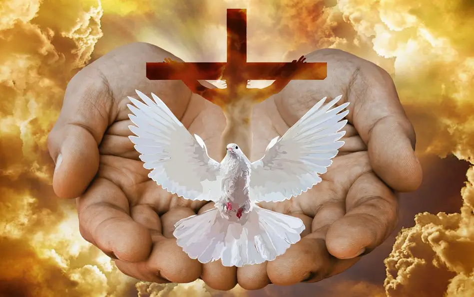 open hands with dove and cross